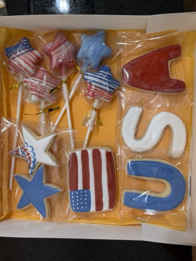 Gift box of decorated cookies and cake pops