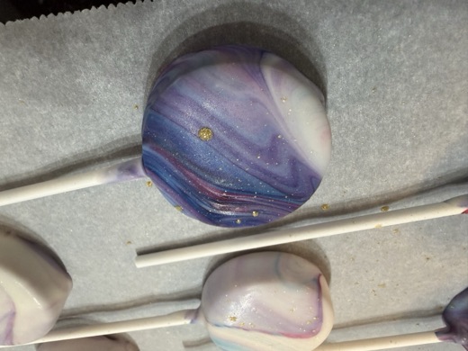 Purple marbled cake pop with gold splatter